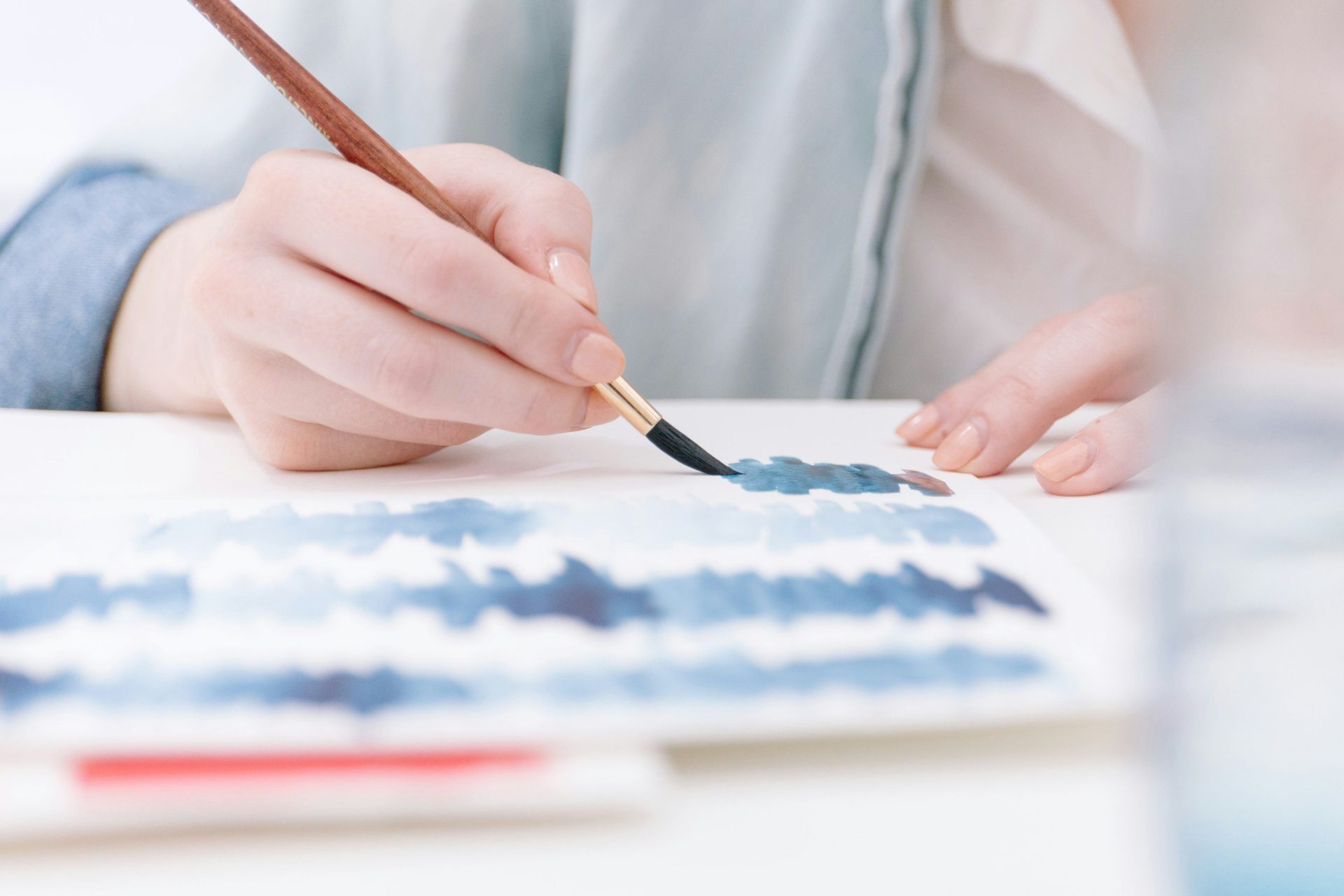 person holding paint brush